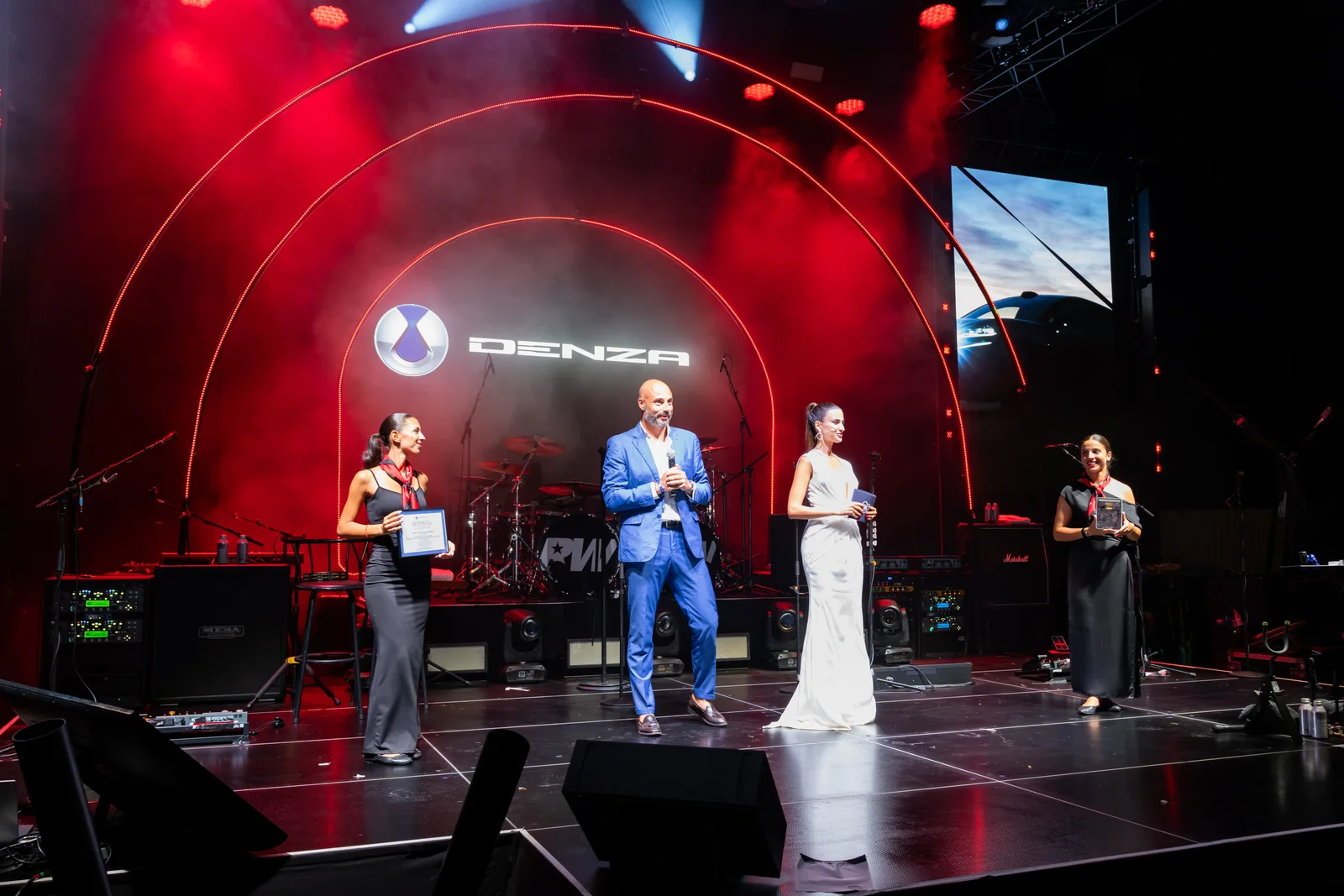 Alessandro Grosso of BYD and DENZA on stage during the festival's award presentation