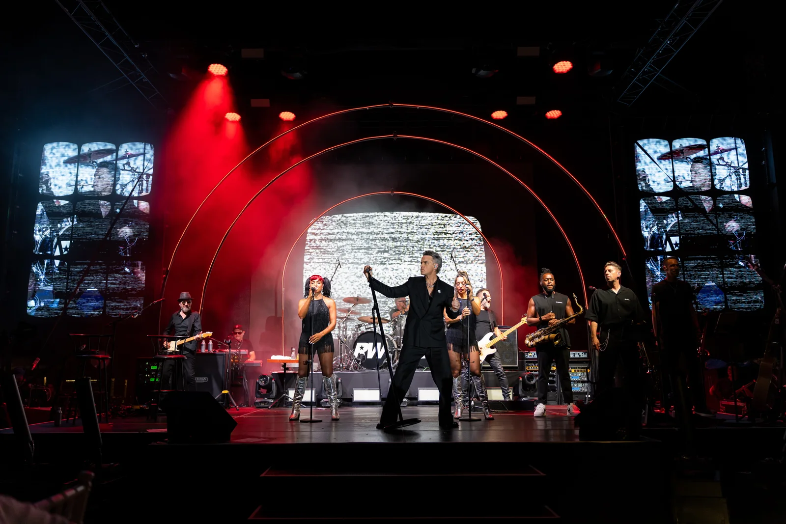 Robbie Williams performs with his full band on the BIG ART Festival stage